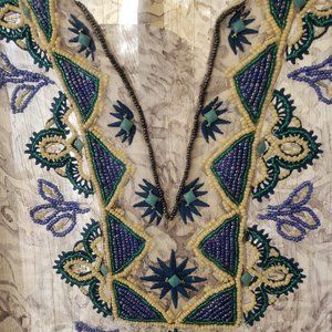 A sheer, beaded top White House Black Market
